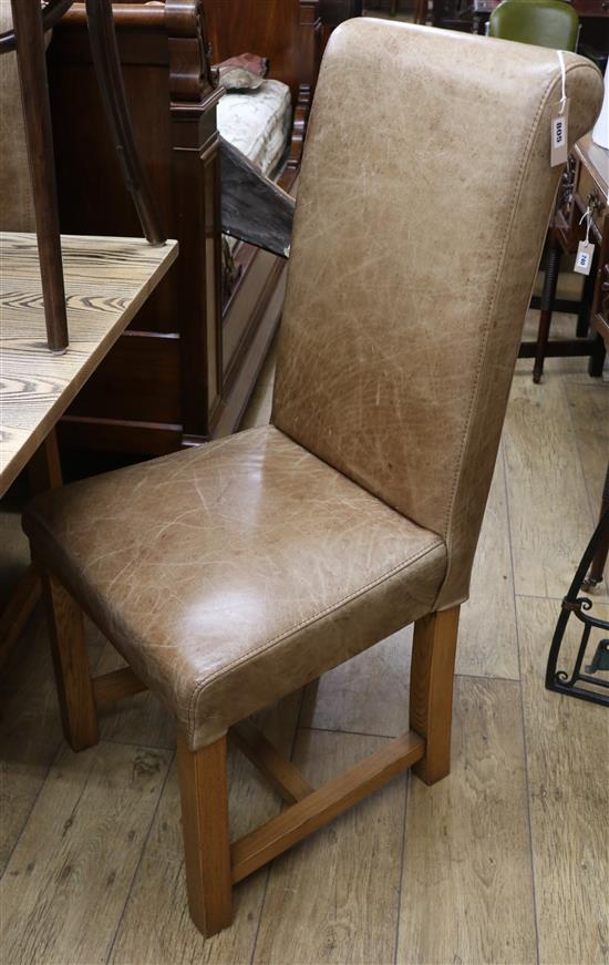 A set of six pale brown leather dining chairs